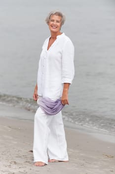 Active senior woman on the beach
