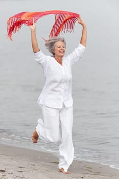 Active senior woman on the beach