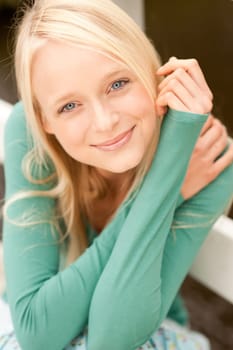 Portrait of a young and smiling woman in the park