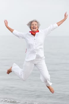 Active senior woman on the beach