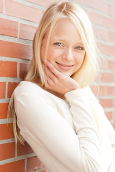 Portrait of a young and smiling woman in the park