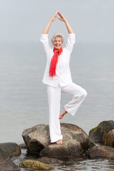 Active senior woman on the beach