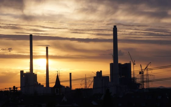 Sunset over the large construction site of the combined heat and power plant in Karlsruhe
