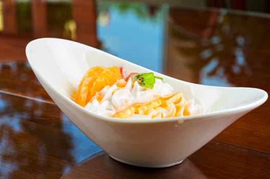 Ice cream dessert with kiwi, strawberry and orange