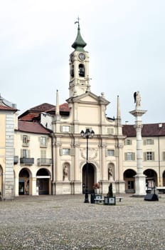 Piazza dell Annunziata square in Venaria Reale with Nativita di Maria church, Turin, Italy
