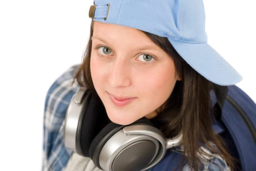 Teenager happy girl enjoy music with headphones and baseball cap