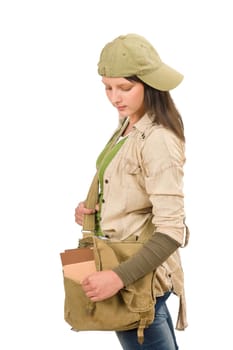 Student teenager girl with schoolbag posing looking inside the bag