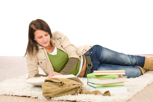 Student female teenager read homework with book on white background