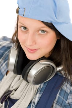 Teenager happy girl enjoy music with headphones and baseball cap