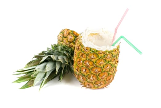 Milk cocktail with pineapple as cup on a white