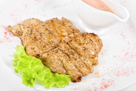 fried chicken steak with greens and lettuce