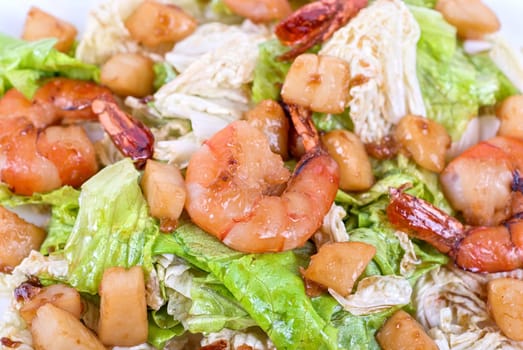 Salad with tiger shrimps and vegetable closeup