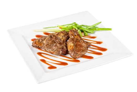 Roasted lamb meat tied with scallion closeup
