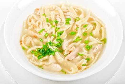 Chicken noodle soup isolated on a white
