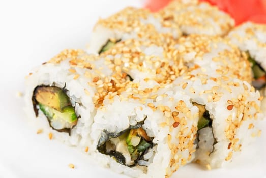 Sushi rolls at plate isolated on a white
