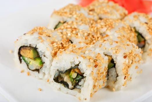 Sushi rolls at plate isolated on a white
