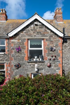 house with walls decorated in tintagel in cornwall