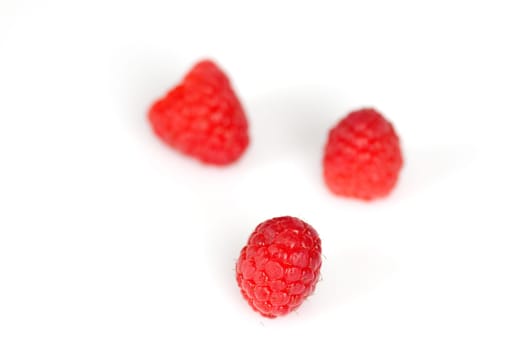 Raspberries on a white background