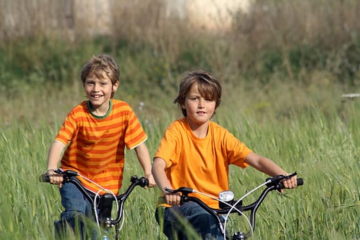 healthy kids playing with bikes