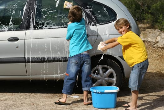 kids washing car doing chores