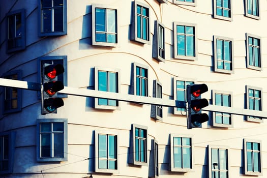 Asymmetrical curves and rows of windows and traffic lights