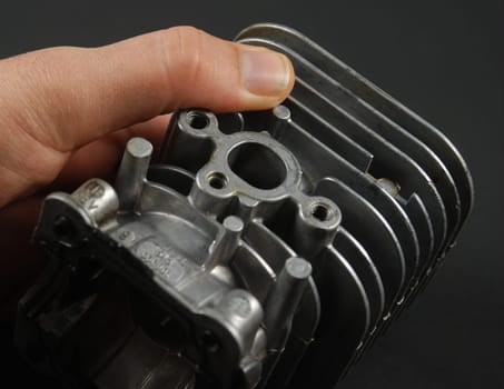 Stock pictures of a small gas engine and a carburetor