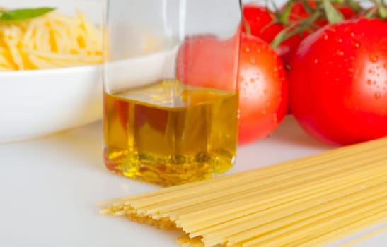 Italian Cuisine - Spaghetti, Fresh Tomatoes and Olive Oil - Shallow Depth of Field