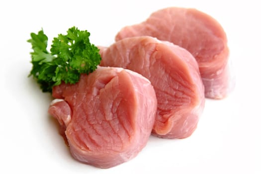 Raw pork tenderloin with parsley