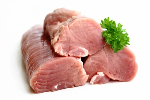 Raw pork tenderloin with parsley