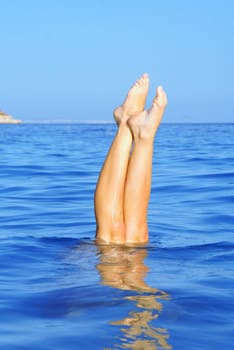 summer holiday vacation, woman diving in sea