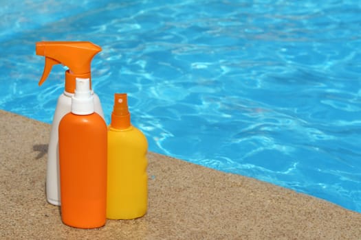 bottles of sun protection cream or lotion for summer vacation