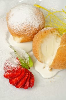 Dessert of ice-cream at biscuit with strawberry and caramel