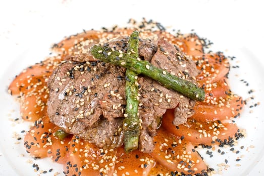 Salad from beef closeup with white mushrooms, string beans, asparagus, spinach, and tomatoes carpaccio