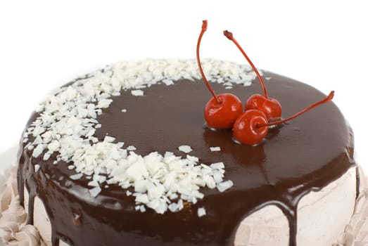 cake closeup with cherry isolated on a white