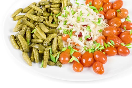Marinated vegetables at the plate isolated on a white background