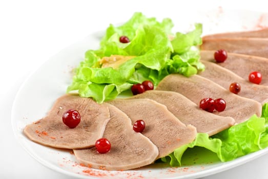 Beef tongue with cranberry isolated on a white background