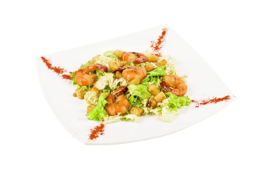 Salad with tiger shrimps and vegetable closeup