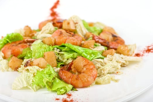 Salad with tiger shrimps and vegetable closeup
