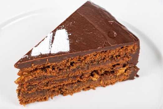Tasty chocolate cake on a plate closeup