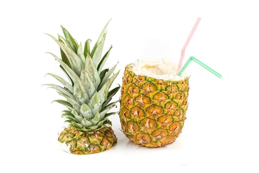 Milk cocktail with pineapple as cup on a white