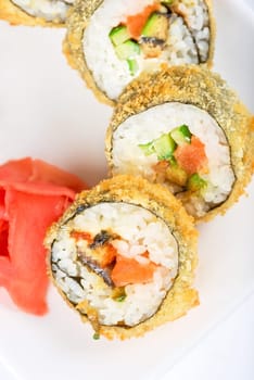 Sushi rolls at plate isolated on a white