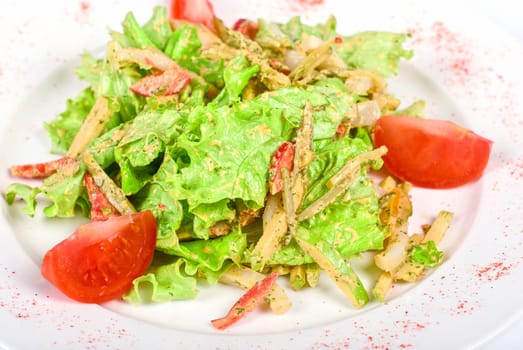 Salad of squid with roast chicken meat, apples, tomatoes, eggs and peppers