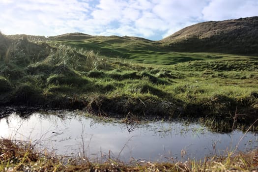 a water trap on a links golf course in ireland