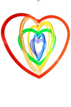 six heart shaped plastic pieces hanging one inside the other on a white background