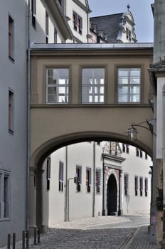 bridge and facade of ancient baroque palace in city center, shot in sunny weather
