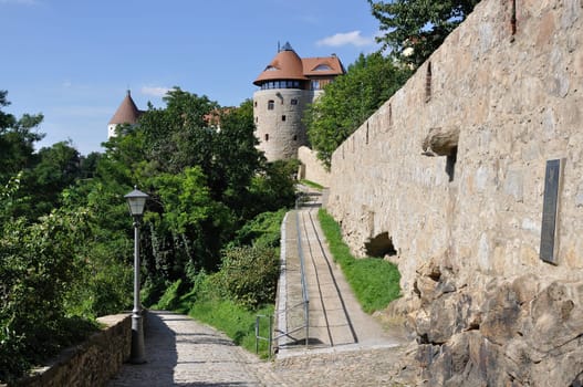 view of the walk in the park near the ancient fortifications and city walls