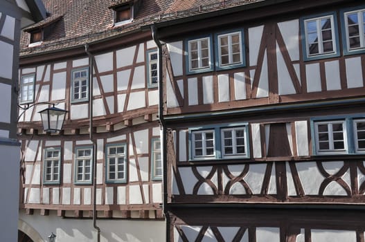 view of sunny facades of old wattle houses in city center