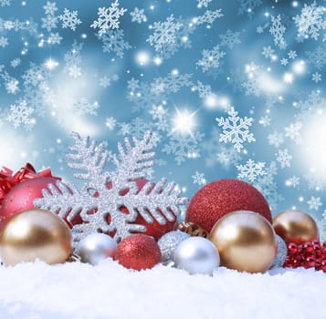 Decorative christmas background with decorations in snow