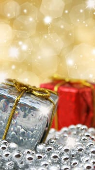 Christmas gifts on glittery gold background