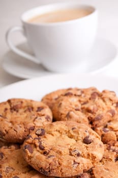 Chocolate Cookies and Espresso Coffee on Wooden Table - Shallow Depth of Field